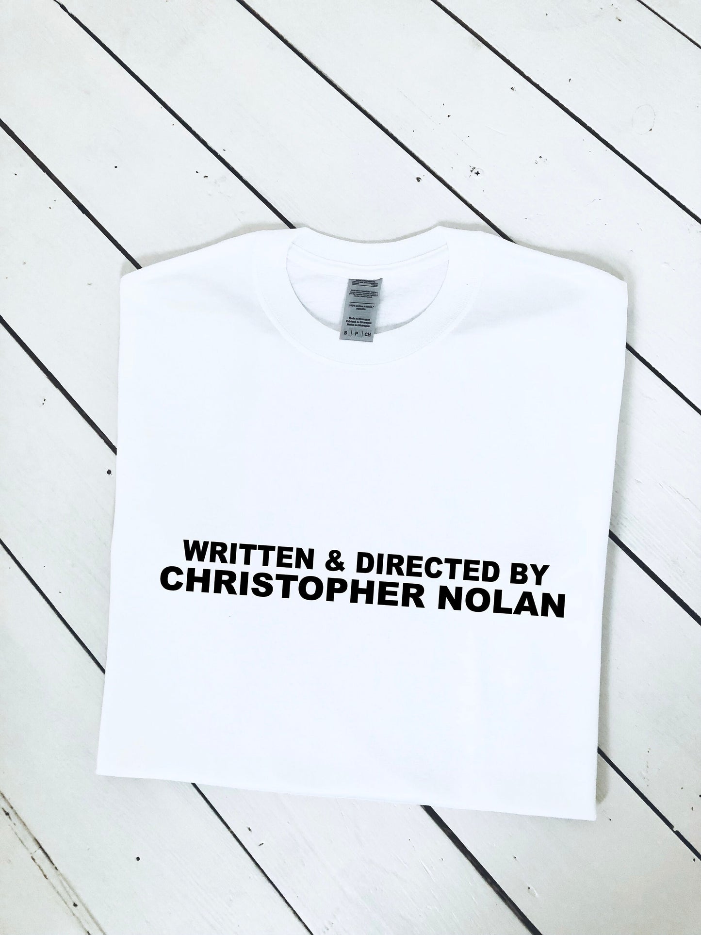 Written and Directed by Christopher Nolan T-shirt, multiple colour tees, mens and womens sizes, movie clothing, movie gift idea