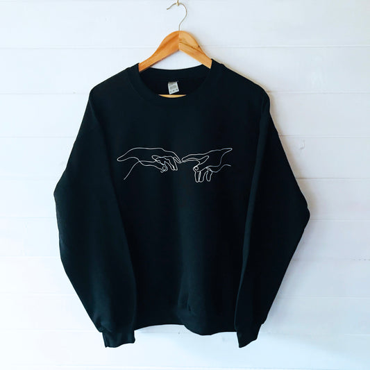 Creation of Adam Black Unisex Sweatshirt with soft fleece-like interior